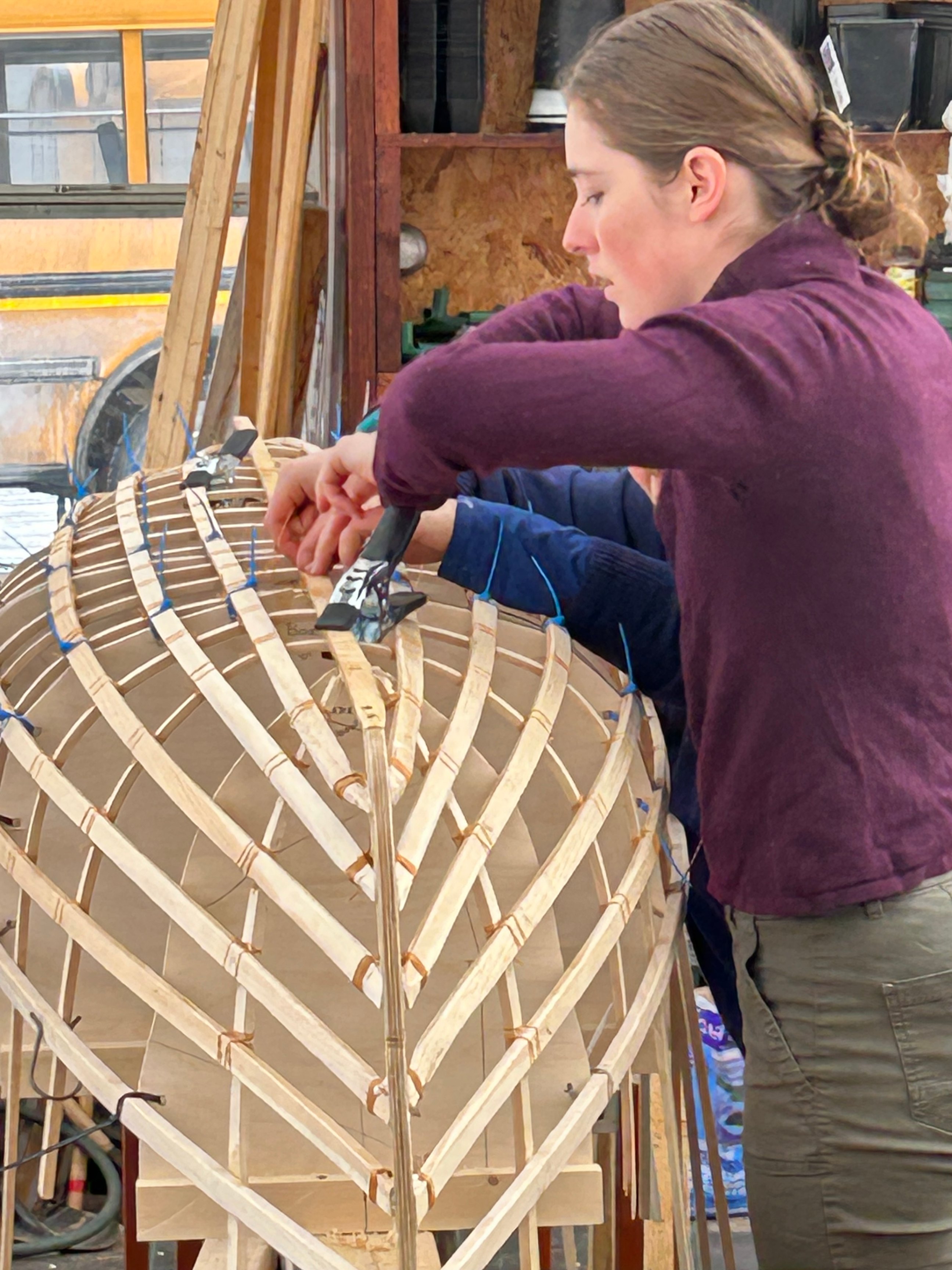 woman building a canoe